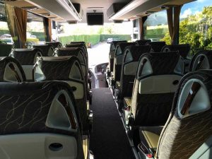 View of the inside of the coach looking back at the driver